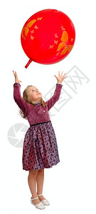 红色的穿着聪明裙子女孩和红气球玩微笑明亮的图片