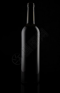 庆典马特颜色黑石灰玻璃瓶子在黑色的毛玻璃瓶子上被隔离图片