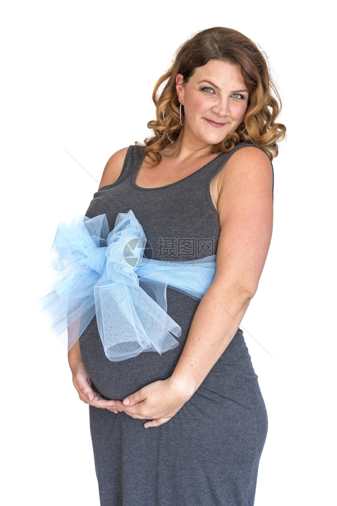 孩子期待的产假成年孕妇将手握在腹部和蓝弓上图片