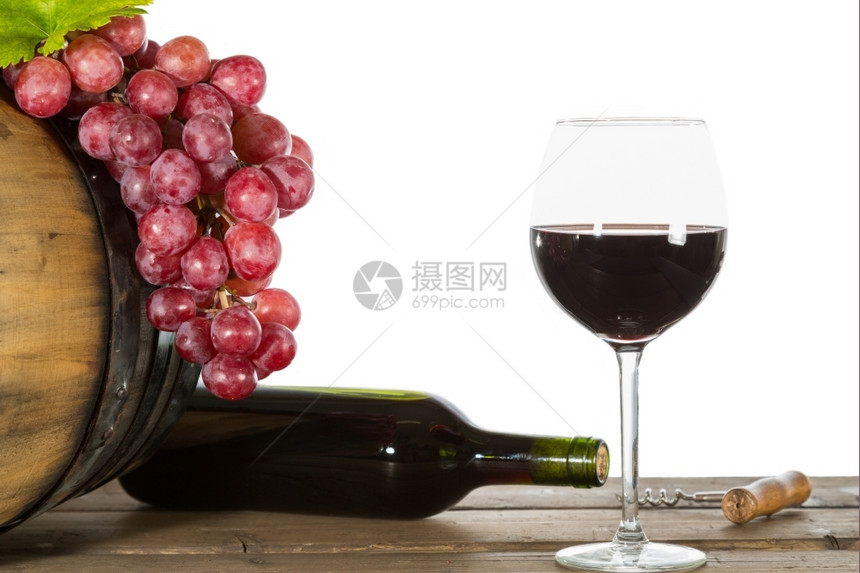 开瓶器波尔多一杯红酒加些葡萄和橡木桶品酒图片