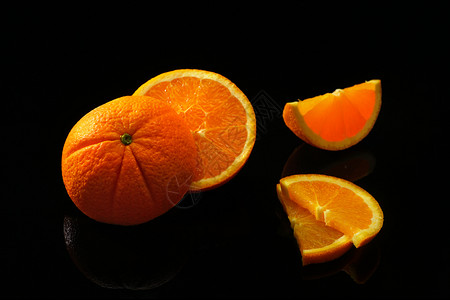橘子一种丰富多彩的黑色背景橙子水果与世隔绝图片