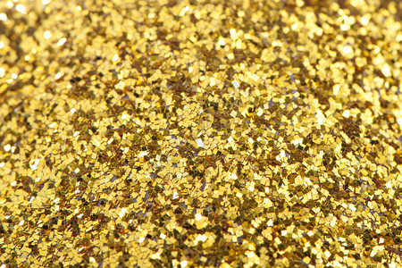 金闪发光的背景糖果闪亮的金色质感在新年圣诞节生日的设计中使用金闪发光的背景亮金色质感光新的为了背景图片