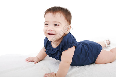 婴儿在白色背景上微笑的特写肖像快乐学步的儿童多米尼奇图片
