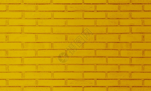 黄色的砖墙现代的石工高清图片