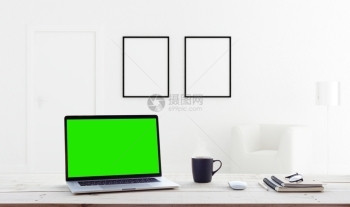 白色的展示在家庭内部背景中显示绿色屏幕的膝上型计算机杯子图片
