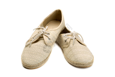 松弛配件一对夏鞋米色蕾丝和织物白色的孤立棕图片