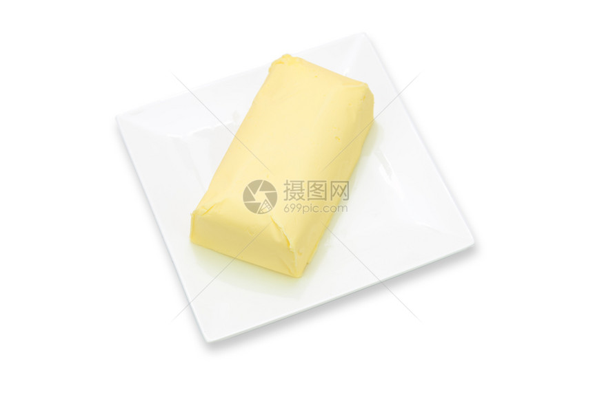 胆固醇最佳盘子上新鲜有机黄油的一块小以白色背景隔绝小吃图片