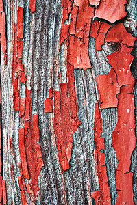 画颜色从旧门木头表面剥离的红色油漆层用于设计的老式纹理离开图片