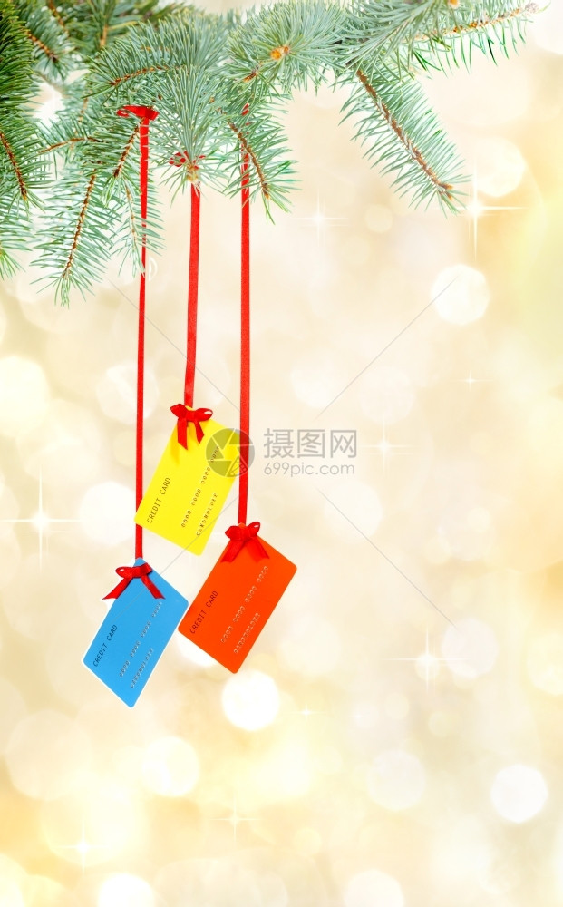 以黄金为主的圣诞装饰信用卡背景面观绞刑发光玻璃图片