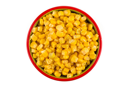 生的食物在白背景上隔绝的碗中甜罐头玉米黄色的高清图片