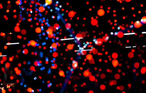圣诞快乐新年盛装红蓝和橙色彩布谷背景美丽模式在派对圣诞节晚宴的夜里突出Xmas光在圣诞庆典上祝黑暗的蓝色设计图片