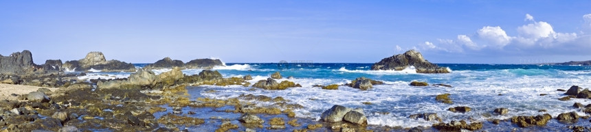 乐趣阿鲁巴野外海洋自然游泳池的全景天空加勒比海图片