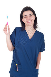 手拿牙刷的青年女医生图片