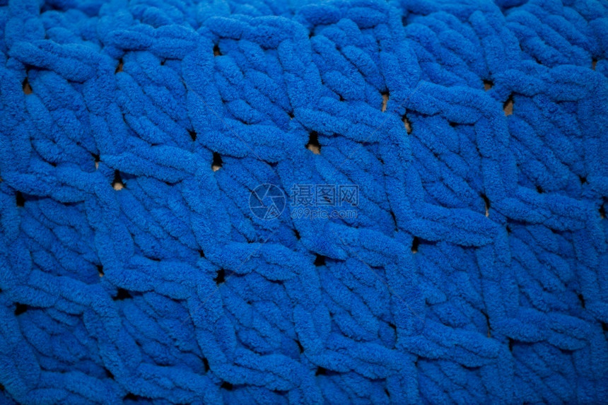 内部的纺织品美利奴羊毛特写漂亮的蓝色毛绒毯漂亮的针织温暖和舒适的概念铭文空间特写铭文的空间图片