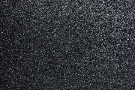 用于演示背景壁纸特写的凹凸不平黑色闪光纹理抽象背景的起疙瘩灰尘背景图片