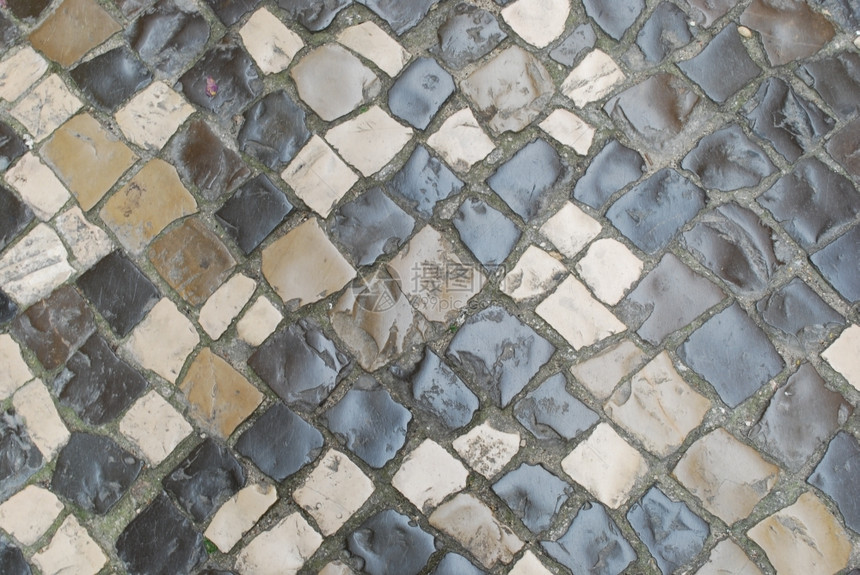 正方形质地灰色的照片由葡萄牙典型石块制成的彩色人行道相片图片