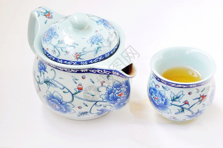粗陶茶具白色背景的中华传统挑逗品一种热的饮料背景