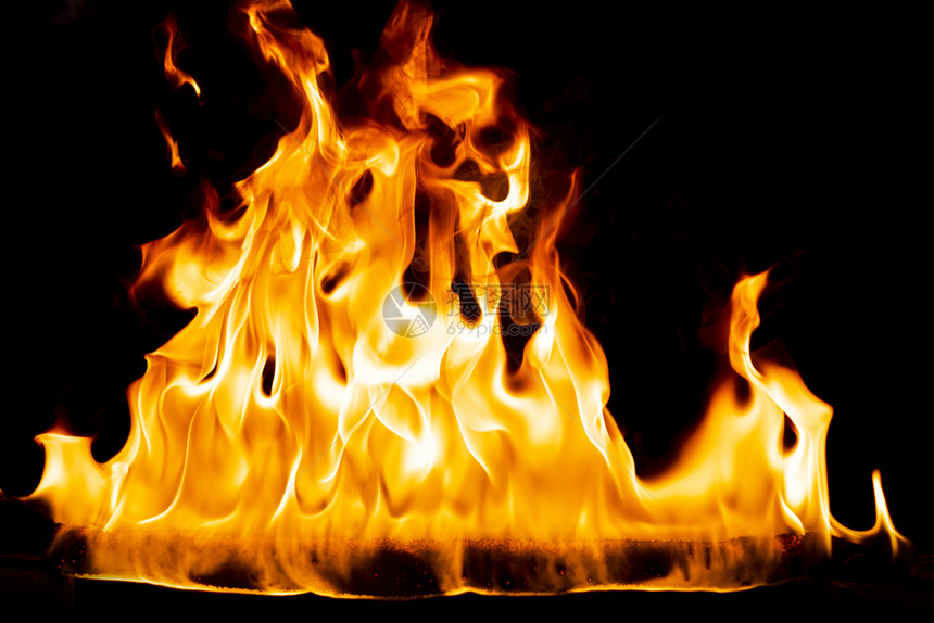 黄色的抽象艺术黑色背景的火焰燃烧红色热火花上升烈橙光闪耀的飞行粒子壁炉易燃图片