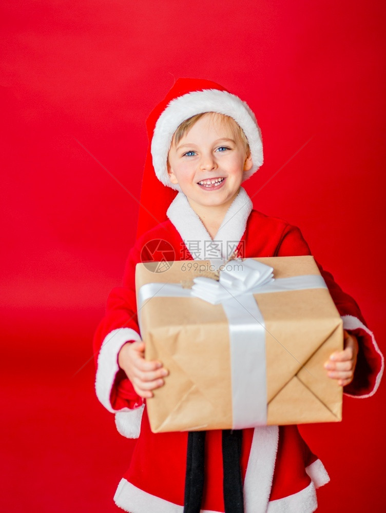 人们吃惊小男孩打扮成圣诞老人购物礼童年新派对圣诞老人宝贝寒假快乐小男孩打扮成圣诞老人购物礼童年新派对圣诞老人宝贝展示图片