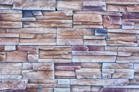 岩石大理墙表面材料天然状岩质砖墙的简表背景摘要以石墙表面为单位抽象的图片