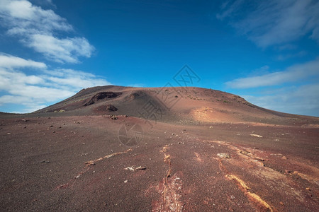 地标西班牙金萨罗特兰岛蒂曼法亚公园的神奇火山景观和熔岩沙漠橙天空图片