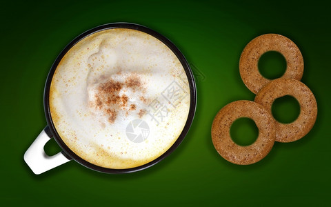 巧克力脸生活咖啡艺术一杯卡布奇诺与绿背景咖啡美术的饼干图片