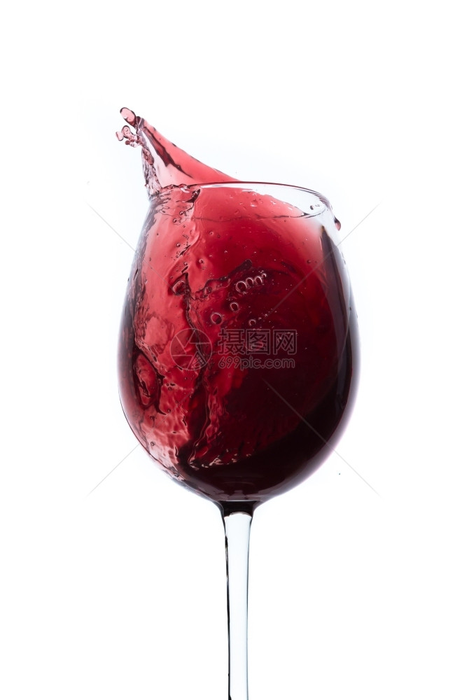 红葡萄酒从玻璃杯中喷出孤立在白色上美食赤霞珠红酒杯图片