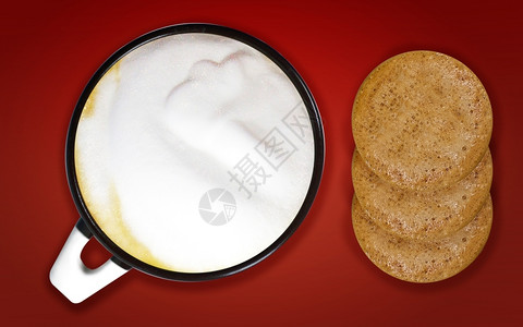 有创造力的杯子咖啡艺术一杯卡布奇诺和红底咖啡的饼干脸图片