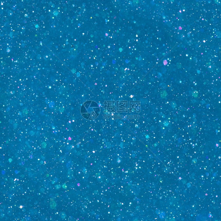 金属的魔法灰尘多色晶粒子蓝背景上闪烁的魔粉尘图片
