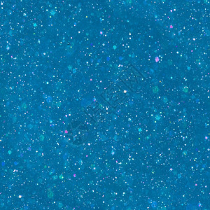 金属的魔法灰尘多色晶粒子蓝背景上闪烁的魔粉尘图片