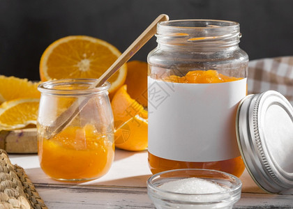 厨具维他命前置视图透明罐子加橙色果酱糖浆图片