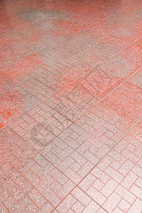 户外城市红砖在人行道背景上铺石头堵塞图片