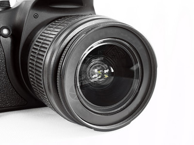 在白色背景上隔离的现代数码照相机现代数字摄影相机电镜片飞涨图片