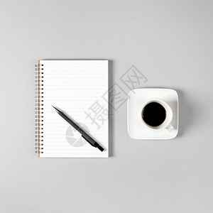 记事本和一杯咖啡背景图片