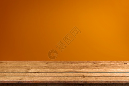 装饰风格最佳万圣节橙背景上的空木板桌布柜台图片