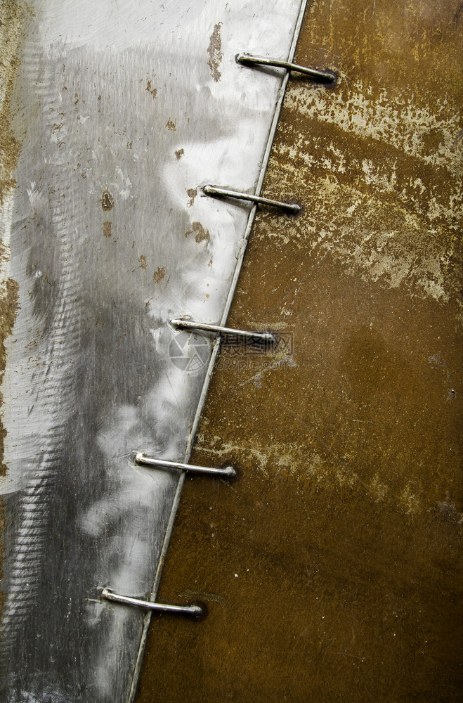垃圾摇滚纹理抽象的生锈金属门安全和保护破坏废弃的细节氧化金属门的安全和保护图片