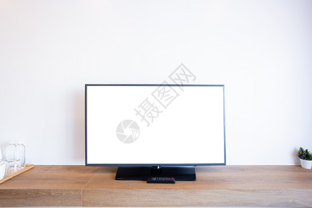 在砖墙内房白色屏幕上播放显示器引导的电视或实际的商业内部图片