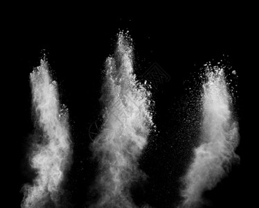 大量的飞溅白色粉末在暗底背景爆炸的冻结运动风图片