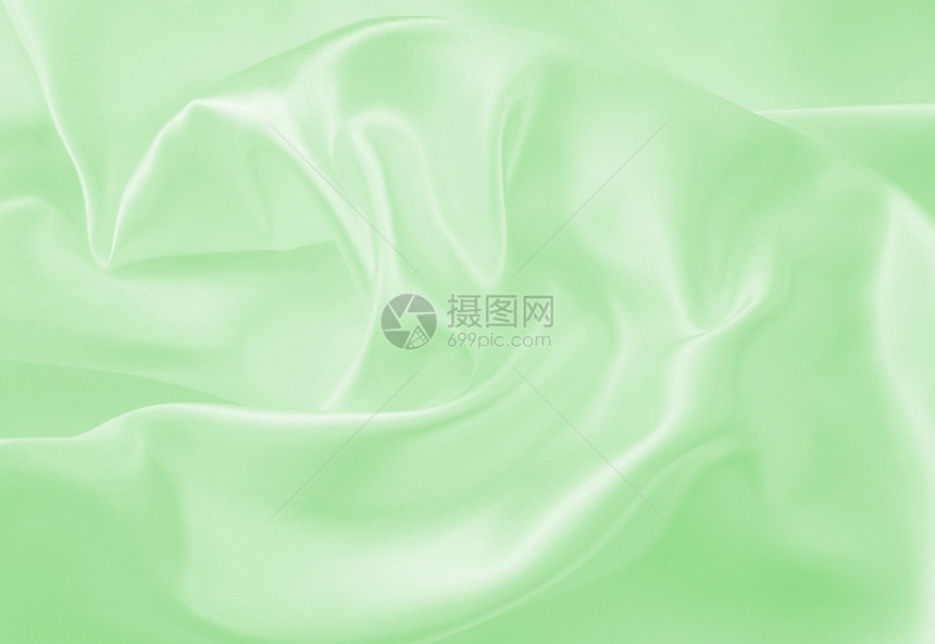 明亮的布料质地平滑优雅的绿色丝绸或纹质可用作背景图片