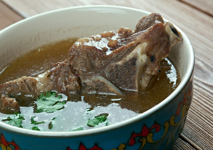 翘脚牛肉肉汤传统的阿民念Khash阿富汗亚美尼阿塞拜疆波斯尼亚和黑塞哥维纳保加利亚格鲁吉伊朗拉克和土耳其的煮熟牛角脚传统菜背景