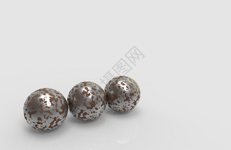 3D让三个老旧生锈的金属球在灰色背景上领域几何的肮脏图片