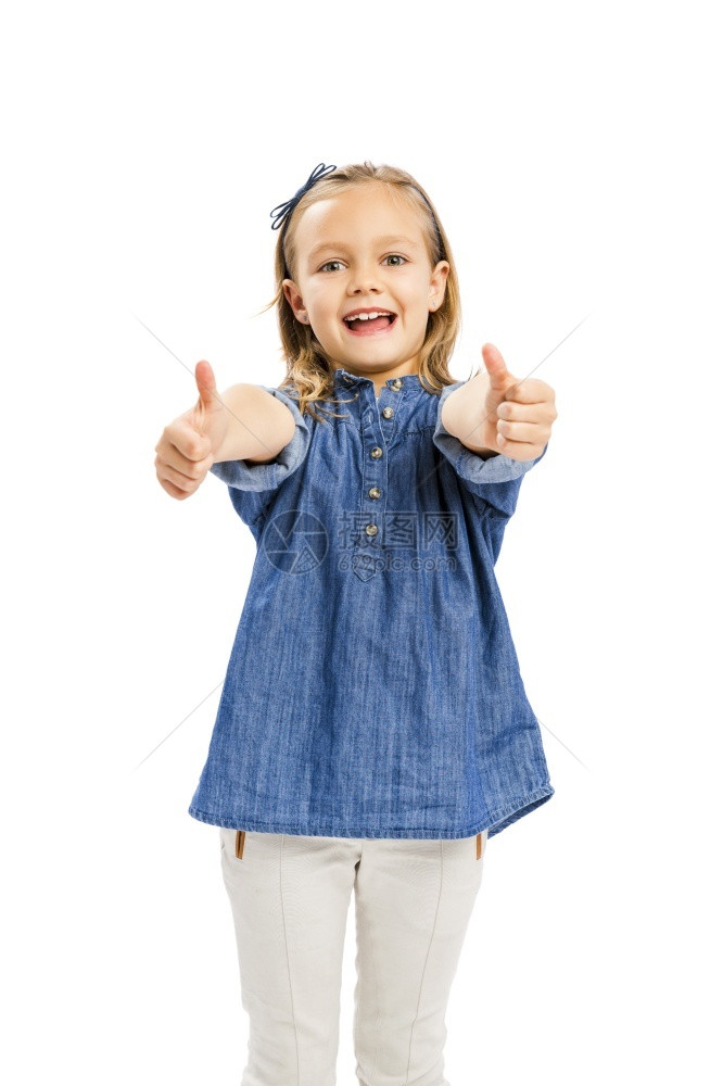 随意的演播室画像一个可爱金发美女孩用拇指举起孤立在白色人们学步的儿童图片