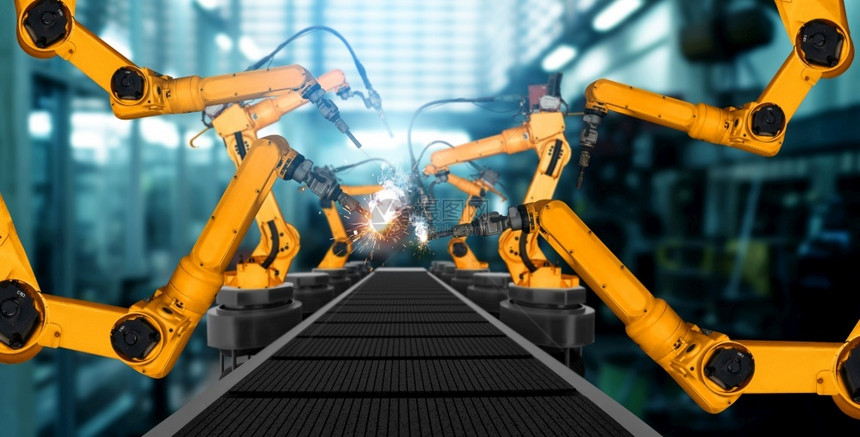 为了部件用于工厂生产线装配的机械化工业臂用于工业革命和自动化制造过程的人工智能概念用于工厂生产线装配的机械化工业臂器人技术图片