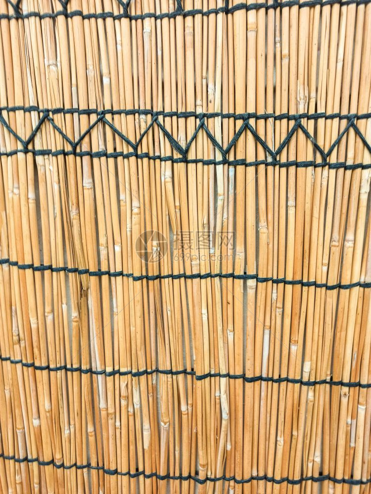 材料墙的纹理由干草制成紧闭着竹子戳图片