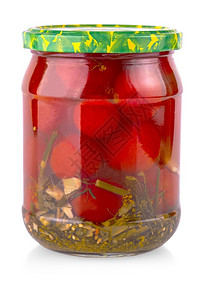 可口在白色背景上隔离的玻璃罐中装西红柿在白色背景上隔离的玻璃罐中装西红柿季节腌料图片