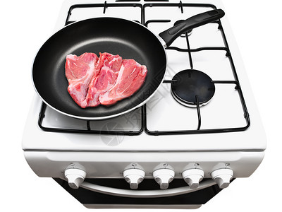 厨房火炉在煤气储存的白蒸汽中用生肉煎锅油炸图片