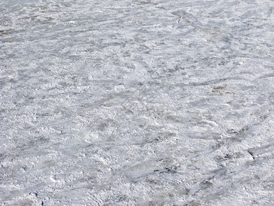 灰色的追踪近乎被划破的冰雪地表背景脚印图片