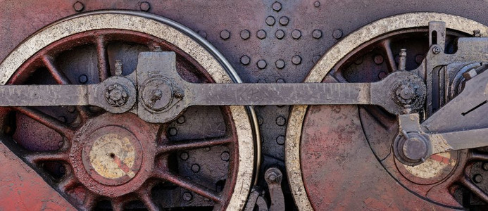 黑色的旧式蒸汽机车轮闭合镜头工业背景的汽车轮机器图片
