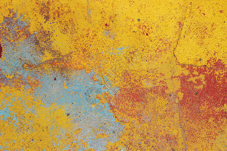 垃圾摇滚裂缝旧墙壁有破碎的彩色石膏背景纹理摇欲坠图片