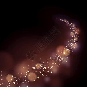 Bokoh背景的闪星尘踪迹发光的圣诞节夜晚图片